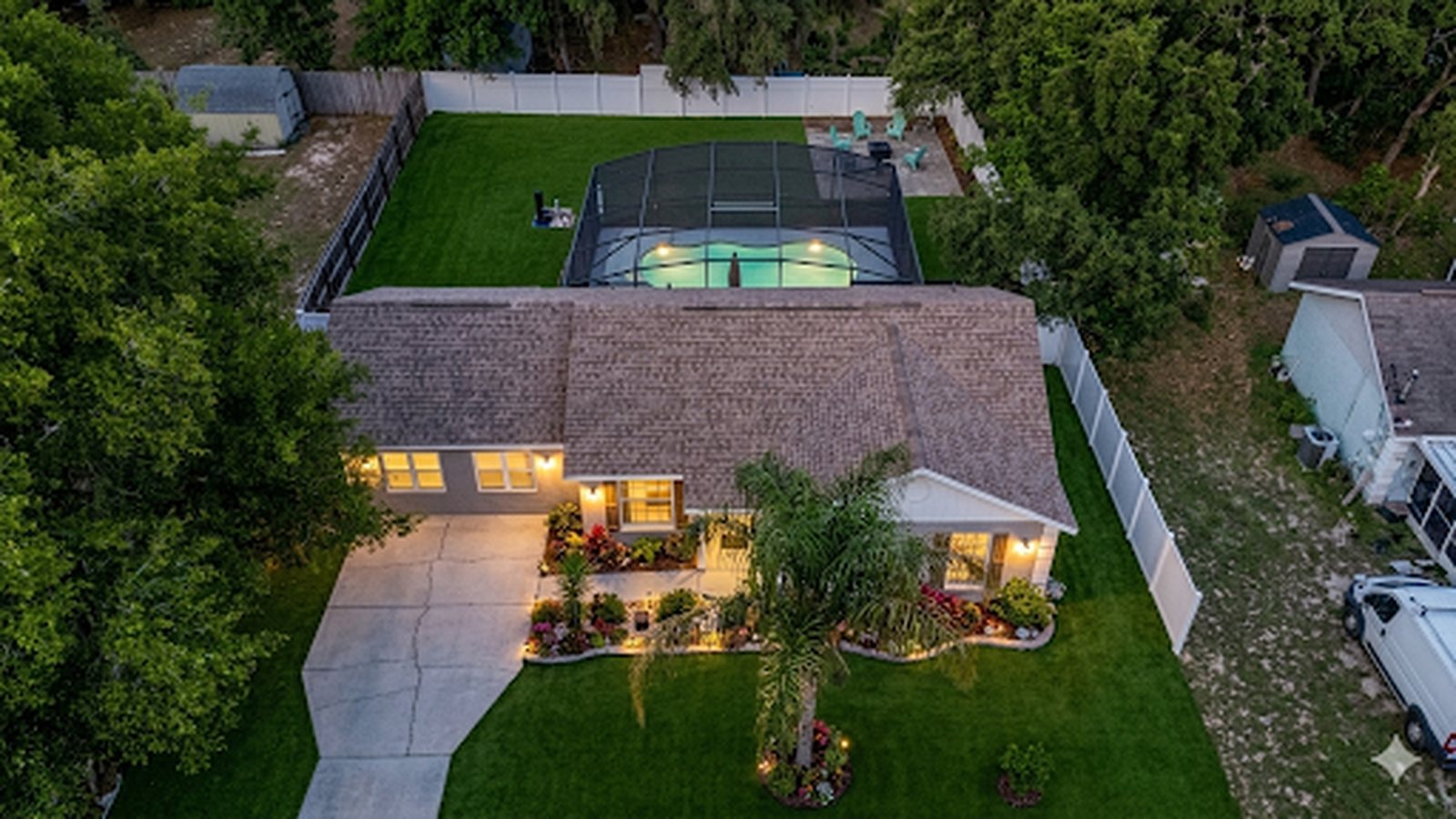 Aerial twilight view of 40140 Palm St, Lady Lake - screened pool